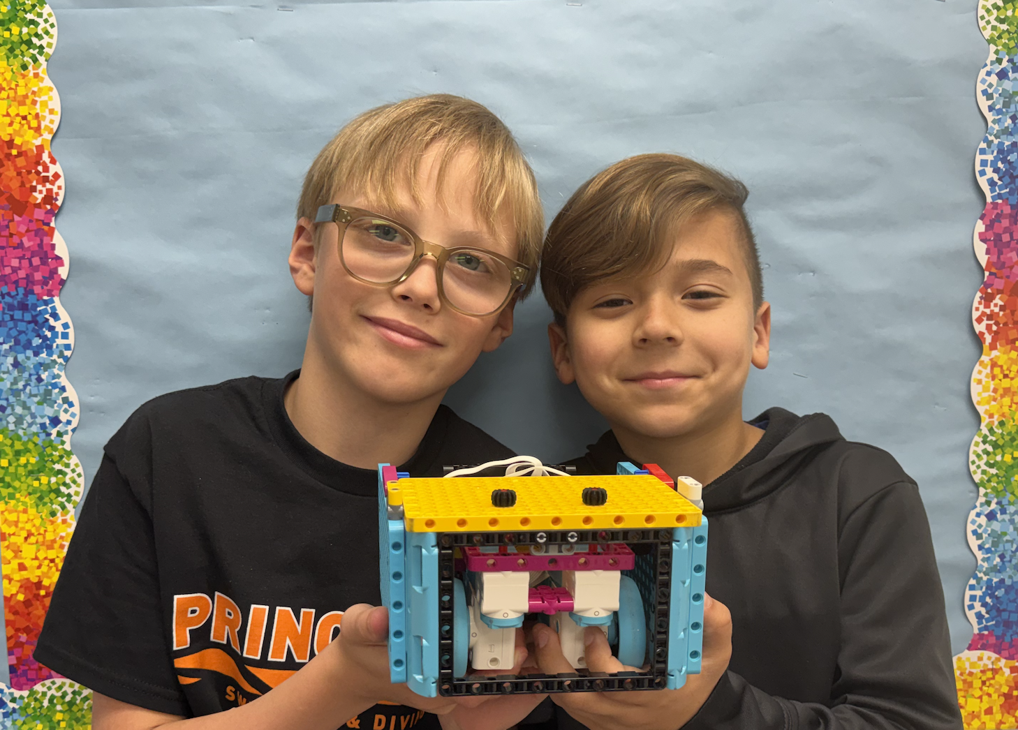 Blue Side team holding their robot
